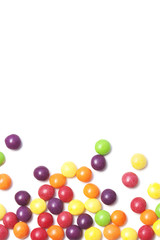 white background with colorful rounded candies on the bottom