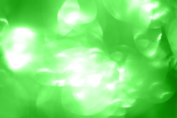 Obraz premium Magic background with green bokeh.