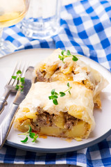 strudel with potatoes and forcemeat. .selective focus.