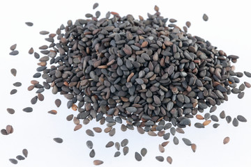 Pile of black sesame seeds isolated on white background