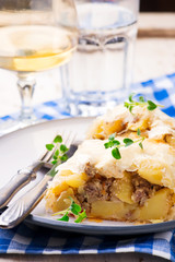 strudel with potatoes and forcemeat. .selective focus.
