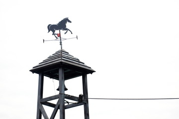 Horse-shaped weathervane on white background.