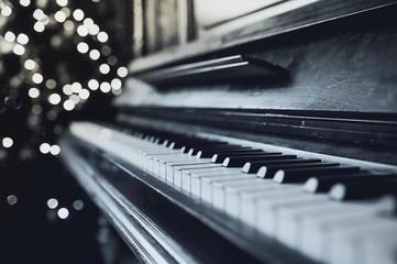 Old vintage piano keyboard. The beautiful background blur