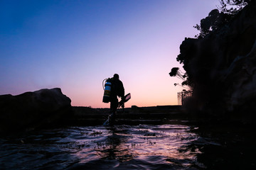 scuba diver at sunset, Sydney, Australia