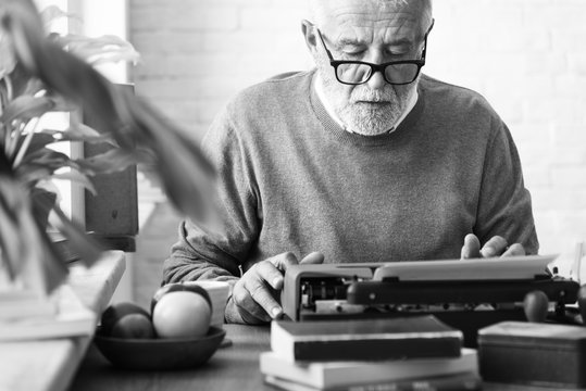 Senior Adult Typing Typerwriter concept