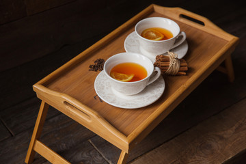Herb tea with spice and lemon for two person. Selective focus
