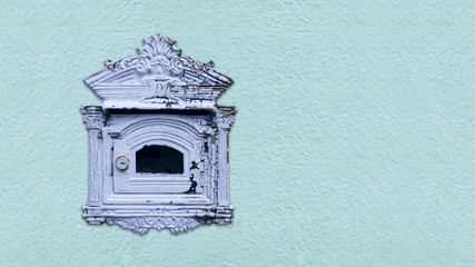 Mailbox old with blue concrete background