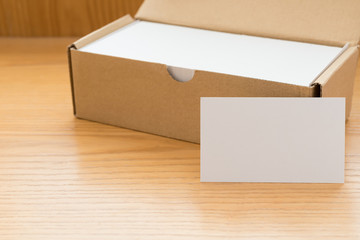 box of business cards with a blank one good for text and logo stands on top