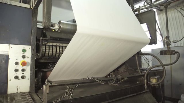 Operation of press in typography, close up.