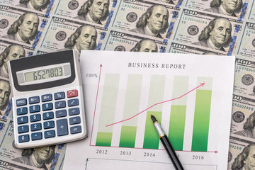 Naklejka na ściany i meble business graph with money on desk.