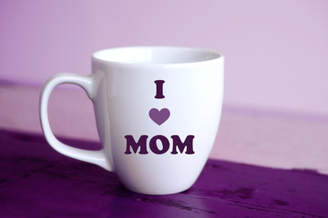 white cup with the words I Love Mom