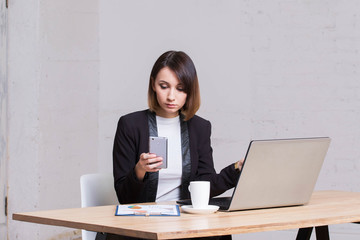 Business woman answers the office phone call works