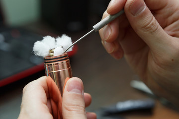 Rebuild vaping device gadget for vaper