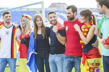 Soccer fans with different national flags