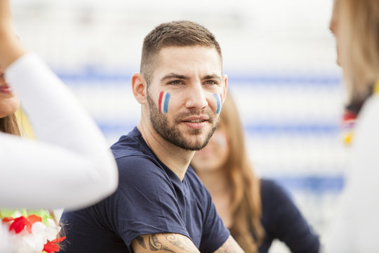 Portrait of soccer fan with face paint