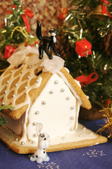 Gingerbread house and Christmas gifts.