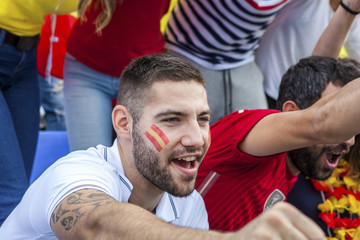 Male soccer fan cheering and shouting