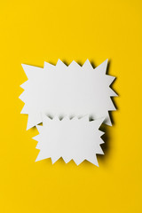 Blank promotional signs on a bright yellow background.