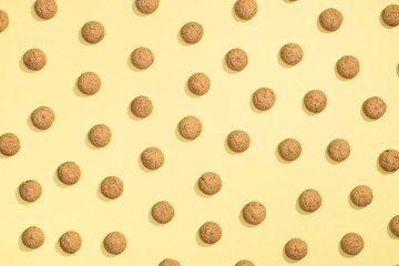 Pattern of cookies on a yellow background