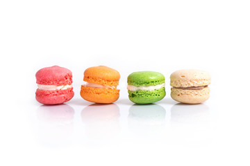 Colorful macaroons isolated on white with space for text. Traditional french dessert.