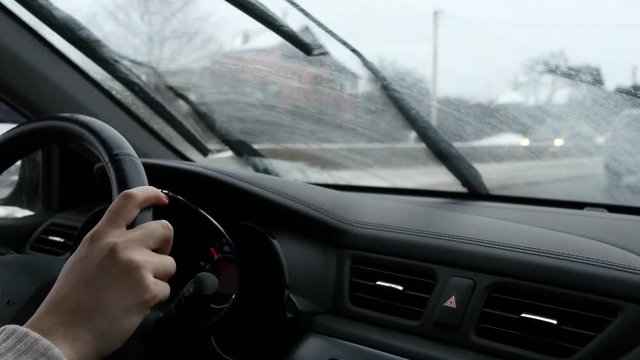 Woman Hands On Steering Wheel Of A Car