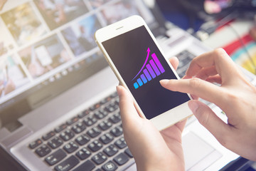 hand holding using mobile phone.girl using smart phone.