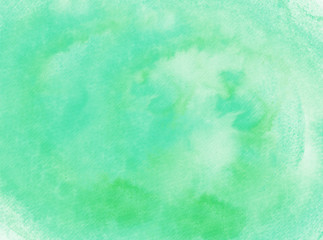 Abstract hand drawn watercolor background on textured paper in green shades - 132938521
