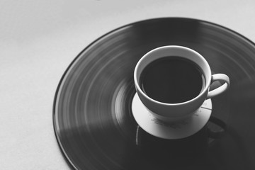 coffee cup on vinyl record