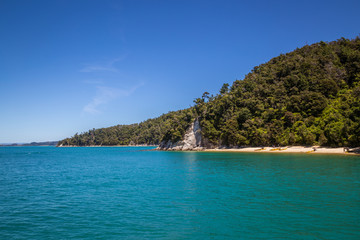 Beautiful landscape with blue turquoise ocean and clear sky in Abel Tasman National Park, New Zealand