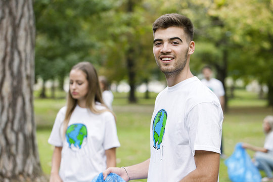 Teenage volunteers doing garbage cleanup in park