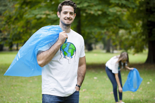 Teenage volunteers doing garbage cleanup in park