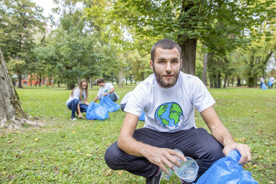 Teenage volunteers doing garbage cleanup in park