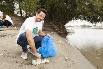 Teenage volunteers doing garbage cleanup in park