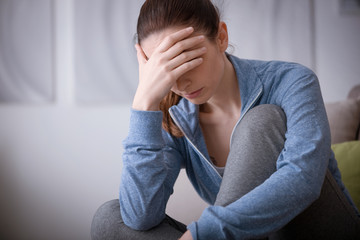 Depressed woman at home