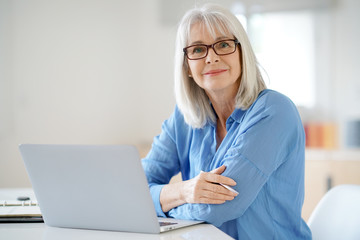 Senior businesswoman working in office