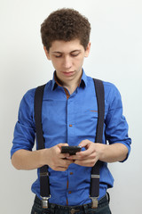 Guy in a blue shirt with a phone on a white background