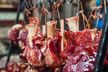 Street food. Pork knuckle cooked on the fire, outside on the Christmas market in Budapest.