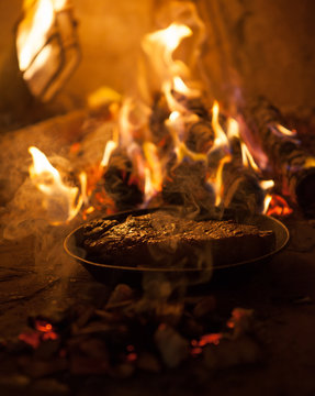 Smoked meat in the fireplace