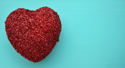 a glitter heart on a blue background, mother's day