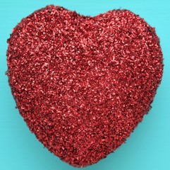 a red heart with a blue background color