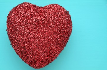 a glitter heart on a blue background