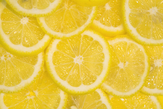 Fresh Lemons Background. Yellow Food Background. Juicy Slices Of Lemon. Top View