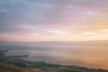 Sunrise in the mountains with a beautiful view of the sea and rocks