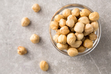 roasted hazelnut in the glass bowl on stone table
