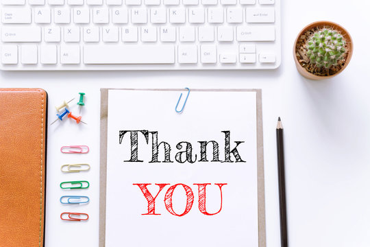 Text Thank you on white paper background / business concept