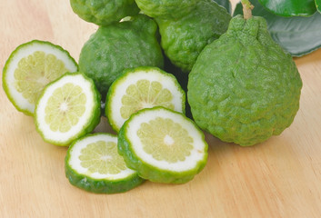 Bergamot fruit isolated on wooden background.
