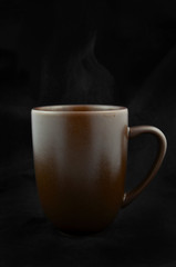 Closeup of coffee cup and brownies.