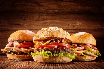 Fototapeten Large chicken, beef and shrimp burgers © exclusive-design