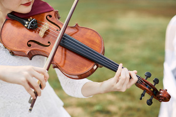 Violinist woman. Young woman playing a violin