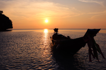 Naklejka na ściany i meble Sunset Beach with a long-tail boat.At ang thong island. 